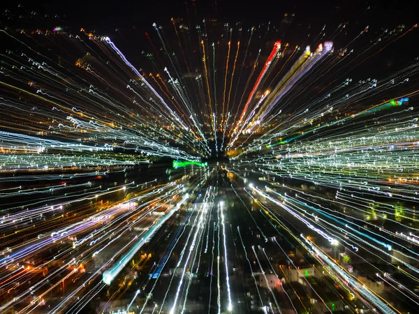 light lines with long exposure,  speed motion abstract background in the dark night ,  blast zoom effect , zoom burst of light in the city