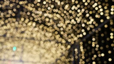 Altın bokeh ışık defocused arka plan ve Noel, yeni yıl için dokulu bulanık sarı tatil kutlama ve parti arka plan 