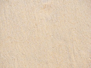 Sahildeki kum zeminini kapatın, arka planda ve desenli