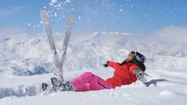 Skier Throw Up Snow In The Air, Raises Her Leg And Falls In The Snow clipart