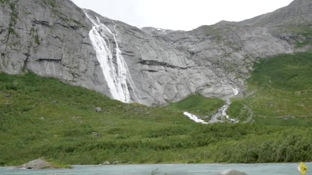 With The High Cliffs Of The Norwegian Fjords Falls Waterfall — Stock Video