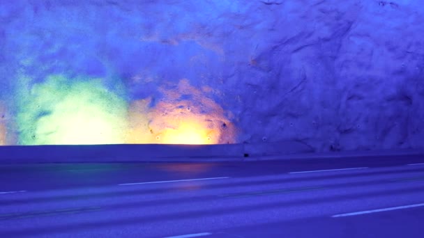 Cars Drive In The Laerdal Tunnel With Colorful Lighting — Stock Video