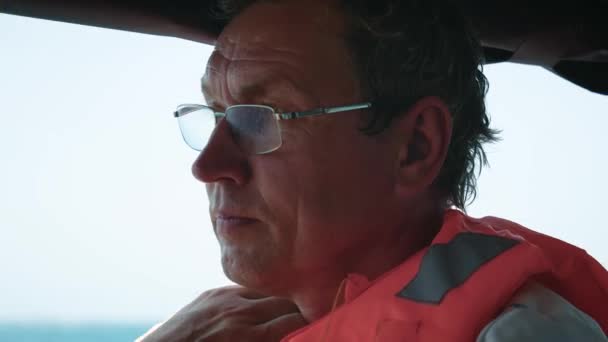 Close Up Of Face Of Man Fisherman In Glasses Floating On Boat On Sea — Stock Video