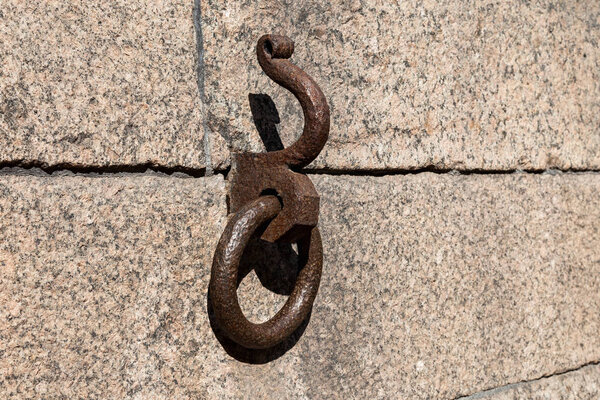 The old hook and ring for mooring in the granite wall