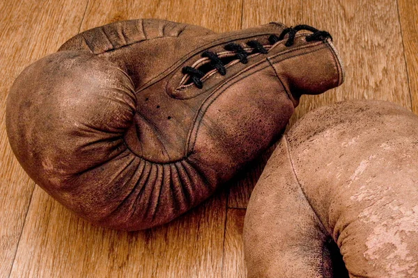 Boxing gloves. Old vintage retro pair of leather worn mittens