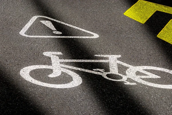 Bicycle lane sign on asphalt road. Concept of biking safety and