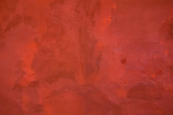 Red painted wall background. Grunge retro aged outside surface f