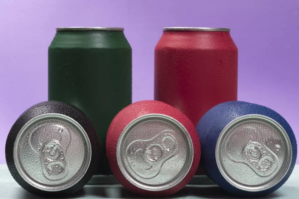 Colorful aluminium cans with a carbonated drink.