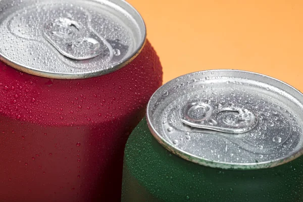 Colorful aluminium cans with a carbonated drink.