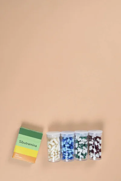 colored capsule of medication in transparent plastic storage and container medicine box - Medicine concept.