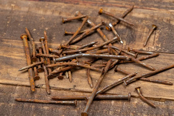 used and rusty nail on old wooden slats. Selective focus