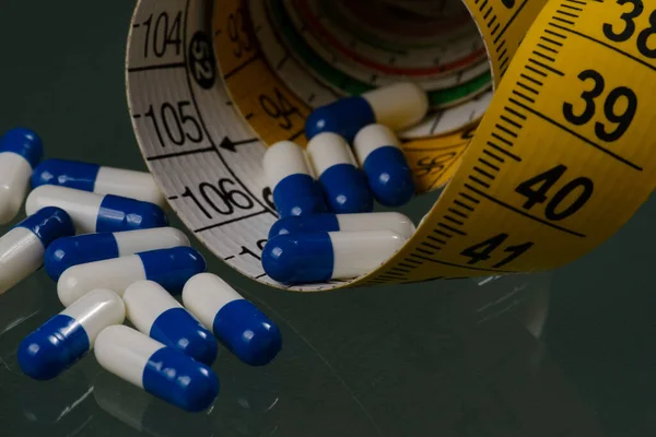 Medicine Capsules Measuring Tape Symbolizing Obesity Treatment — Stock Photo, Image