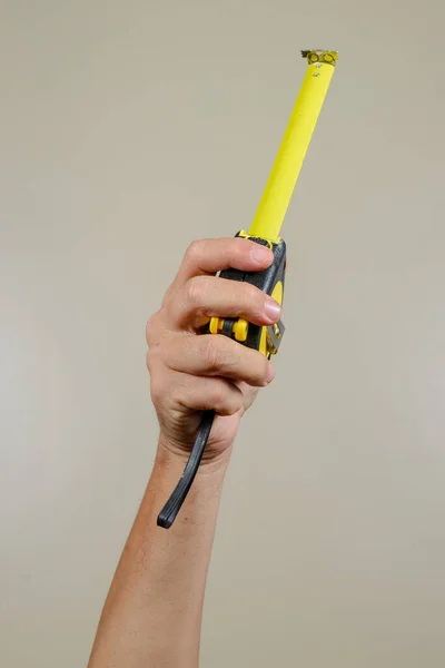 industry worker hand holding mechanical tool