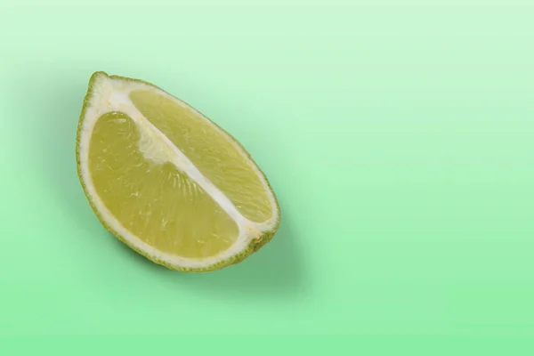 Tahitian Lemon Cut Four Light Green Background — Stock Photo, Image