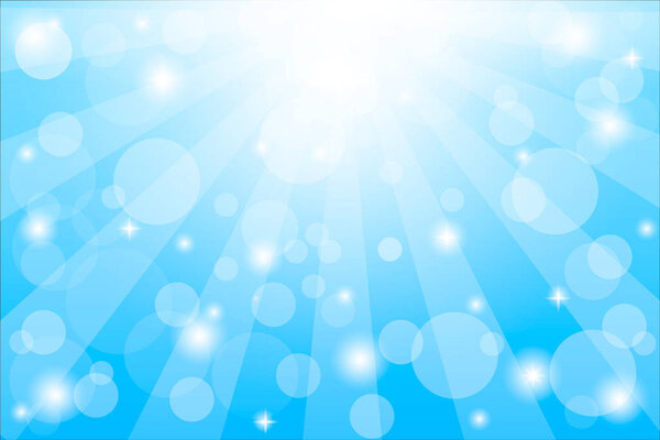 Sparkling blue festive star burst background with a dynamic bright white explosion of rays of light over a twinkling bokeh
