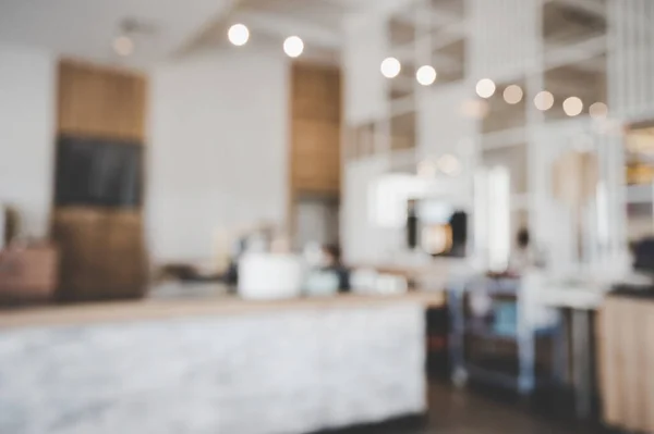 Blurred images of the coffee shop interior background and lighting bokeh