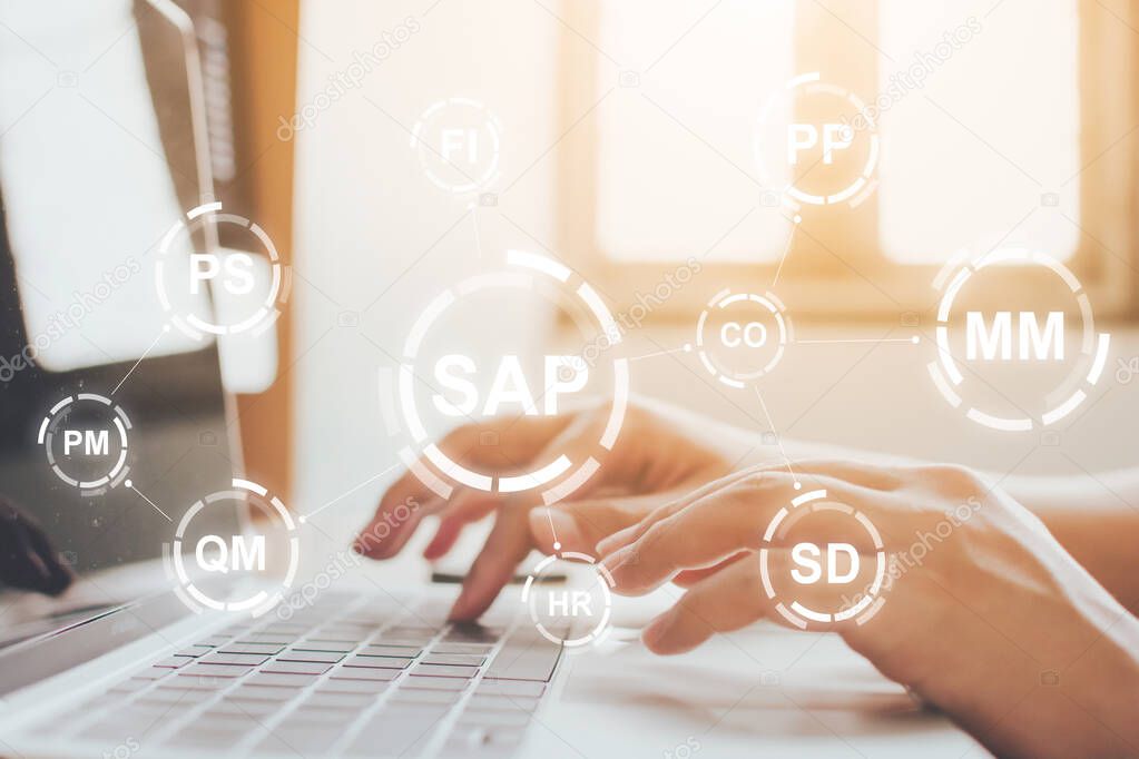 Close-up image of male hands working on laptop. Business management software (SAP). ERP enterprise resources planning system concept