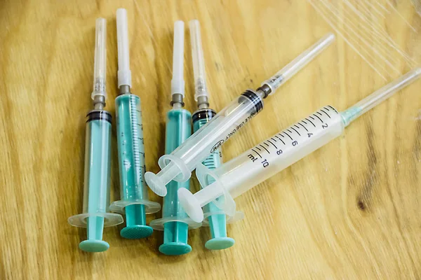 pictured in the photo many disposable syringes