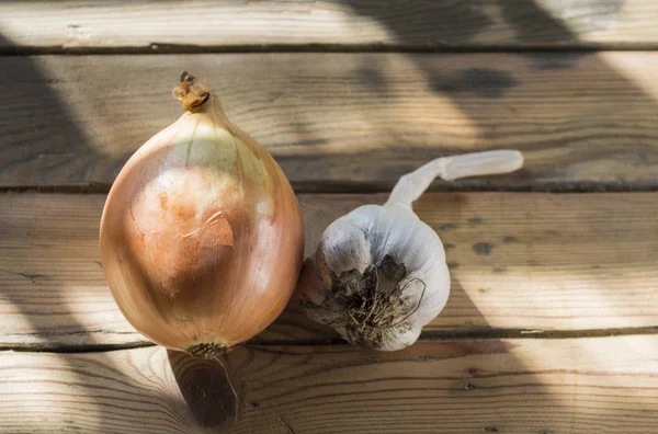 garlic onion on wooden background, closeup
