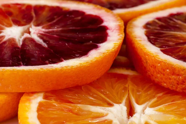 Background from slices of red orange slices, close up