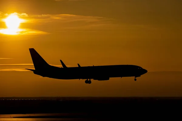 Plane on sunset — Stock Photo, Image