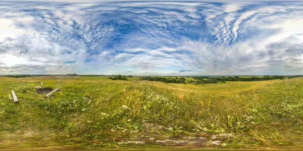 Sunset or sunrise in the green field with blue sky. Image with 3D spherical panorama with 360 viewing angle. Ready for virtual reality or VR. Full equirectangular projection. Green grass. Hills. — Stock Photo, Image
