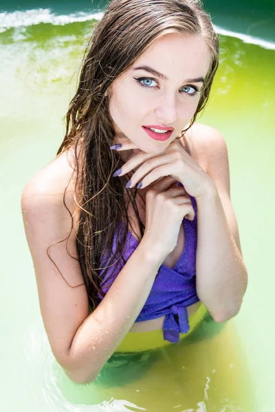 Wet model takes a shower and swims in clothes, wet clothing, Wet Look women\'s, sauna and swimming pool.