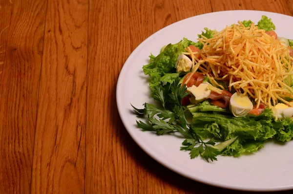 Ethical vegetarian or vegan meal. Boiled quail eggs in a spiralized fried potato french fries nest, Served with baby leaf salad. Healthy low calorie slimmer's meal made with a spiralizer