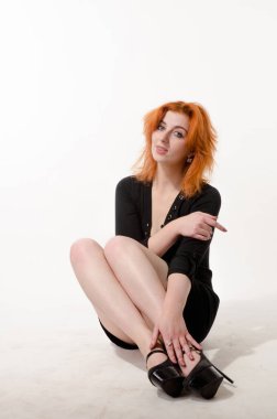 Young brunette woman with long hair and pretty legs in short skirt standing  full height isolated on white background - both front and back views