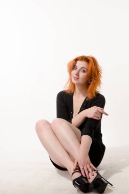 Young brunette woman with long hair and pretty legs in short skirt standing  full height isolated on white background - both front and back views