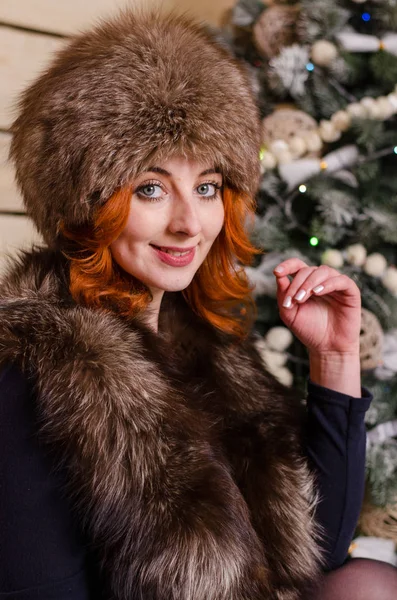 Beautiful sexy redhead girl in a New Year 's — стоковое фото