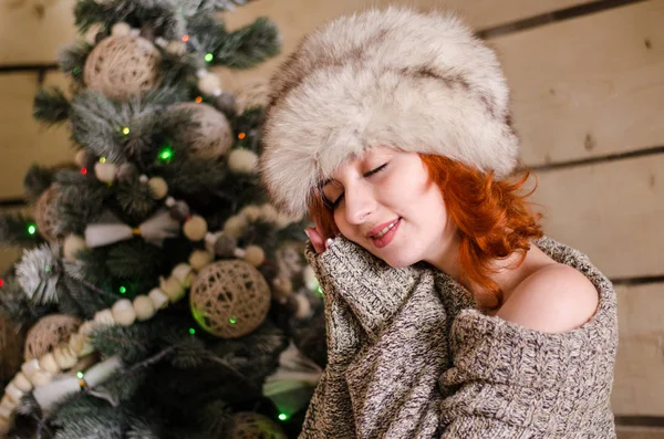 Beautiful sexy redhead girl in a New Year 's — стоковое фото