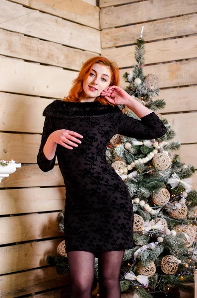 Beautiful sexy redhead girl in a New Year 's — стоковое фото