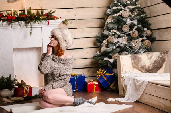 Beautiful sexy redhead girl in a New Year 's — стоковое фото