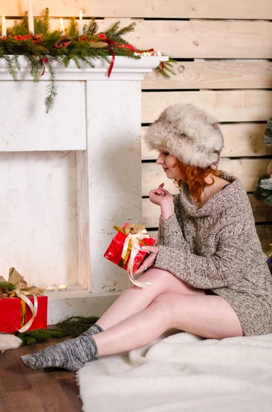 Beautiful sexy redhead girl in a New Year's — Stock Photo, Image