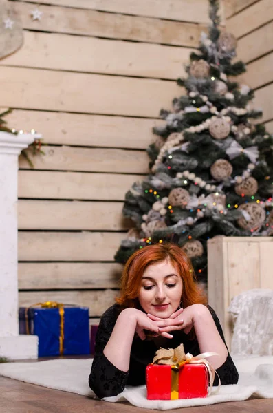 Beautiful sexy redhead girl in a New Year 's — стоковое фото