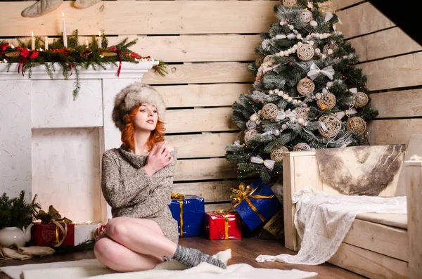 Beautiful sexy redhead girl in a New Year 's — стоковое фото