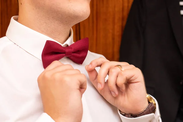 man in a tie, the groom tightens his tie, The morning of the groom, man in white shirt