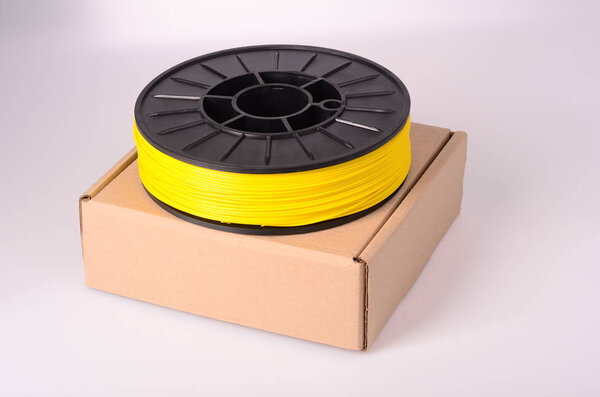 Filament for 3D Printer crystal clear and bright against a bright background.
