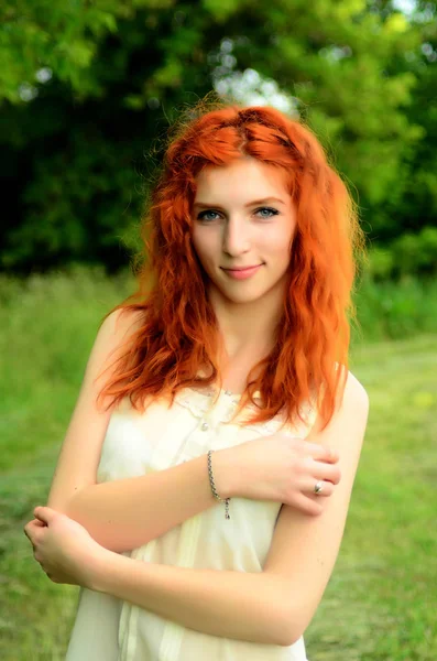 A young beautiful ore girl of the Caucasian appearance is having fun with pineapple. Place for text.Vegan, vegetarianism, healthy lifestyle, positive concept — Stock Photo, Image