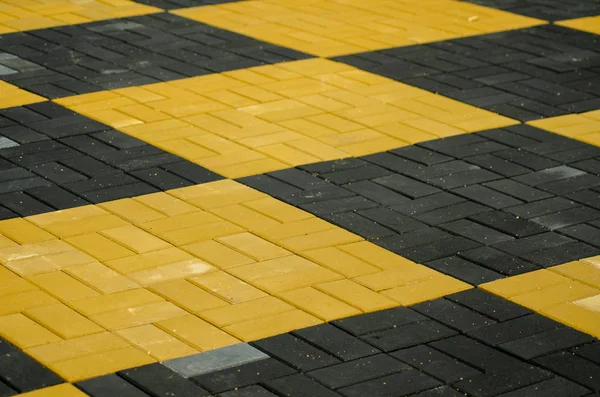 Colored paving stone, yellow black — Stock Photo, Image