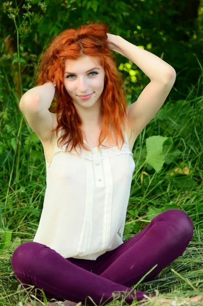 A young beautiful ore girl of the Caucasian appearance is having fun with pineapple. Place for text.Vegan, vegetarianism, healthy lifestyle, positive concept — Stock Photo, Image