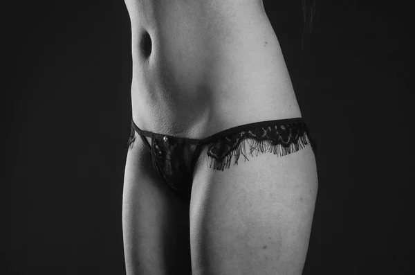 Lovely slim model posing against dark background — Stock Photo, Image