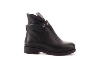 Klasik siyah ve beyaz spor ayakkabı kadın bacaklar. Bacakları yukarı doğru kaldırdı ve yan yana sarkıtmak. Gri arka plan. Klasik ayakkabılar. Sağlıklı yaşam tarzı