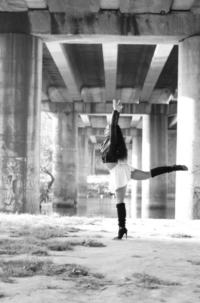 Close-up portrait of a fantastic young model girl posing in the park on a sunny day. Black and white photo — Stock Photo, Image