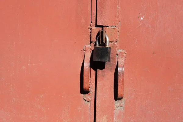 Background striped red metal profile. Texture of painted red metal surface