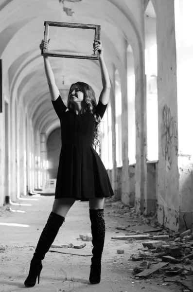 Young beautiful short hair blonde woman in black climbing the st — Stock Photo, Image