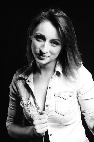 beautiful woman with sort hair posing on dark background