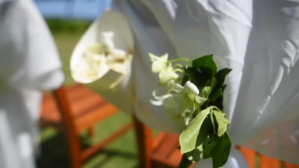 Decorative jewelry from the flowers on the wedding chair — Stock Video