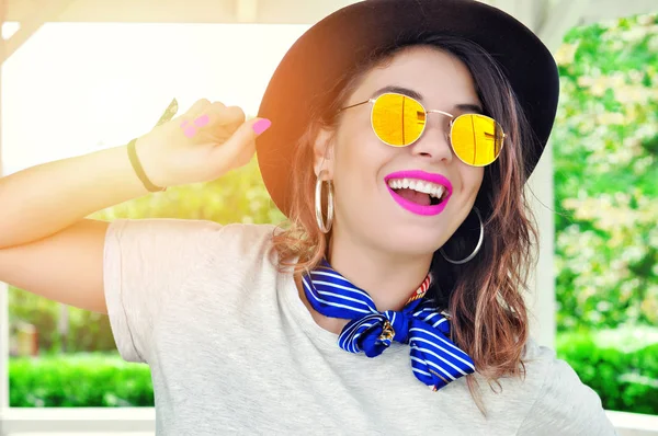 Summer city vibes. Sunny lifestyle fashion portrait pretty young smiling  woman having fun wearing trendy outfit sunglasses pink lipstick
